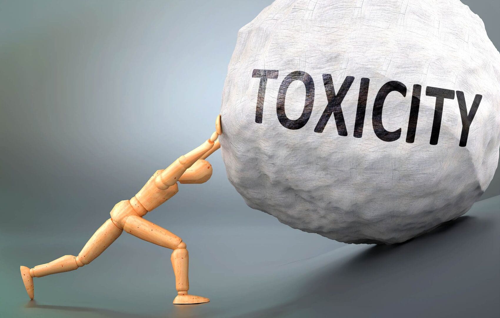 A wooden figure pushing a rock with the word " toxic ".